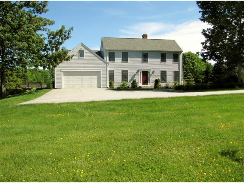 Large cook's kitchen with granite counter tops, formal dining room, living room with 
		brick fireplace - home for sale in Belfast, Maine