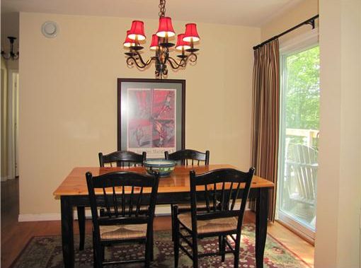 Cape with open floor plan, 1st-floor master BDR suite, wood stove, large deck and 2-car garage - Maine Real Estate Listing - Northport, Maine - Cape with open floor plan, 1st-floor master BDR suite, wood stove, large deck and 2-car garage