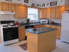 A short stroll to the ocean, Bayside Village pier, yacht club and golf course, this immaculate, well-maintained home is sited on a private, 
		1.34-acre lot with glimpses of Penobscot Bay.