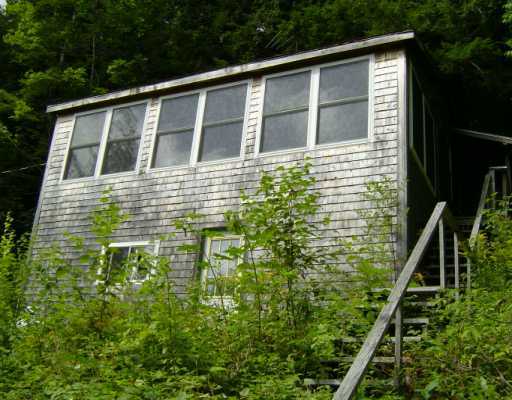 Secluded Paradise Nestled Among Majestic Pines - Comfy camp includes a picnic area w/100 ft. of lake frontage across the street -
Bring your fishing rod! Keep your boat at the lake. 