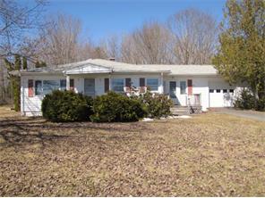 large backyard for garden beds and an oversized attached garage 