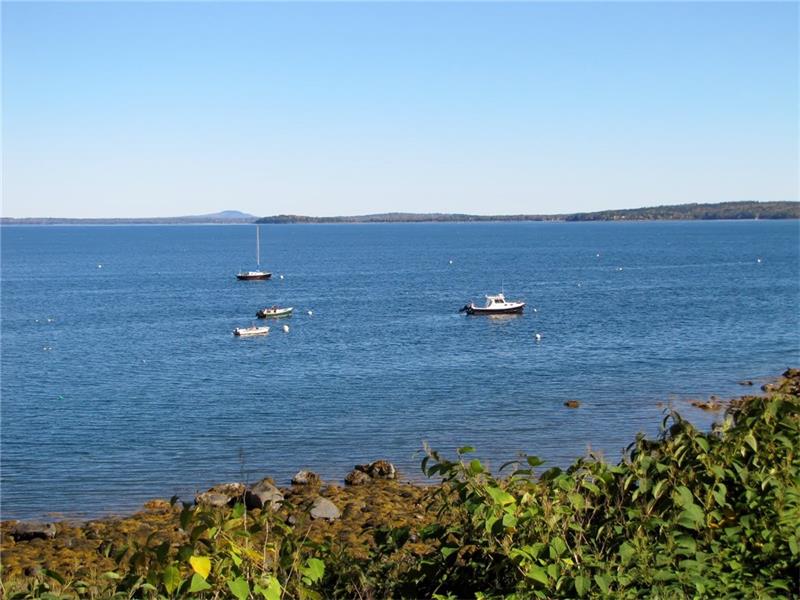 quintessential oceanfront cottage with a wraparound porch - steps to your own 70+/- feet of shoreline on Penobscot Bay 