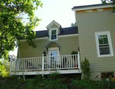 Photo of Side with Deck of Renovated House in Belfast, Maine