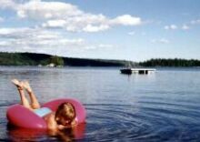 Playing on a tube on Maine lake