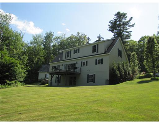 Real Estate Listing - Northport, Maine - Open floor plan, 1st-floor master BDR suite, wood stove, large deck and 2-car garage